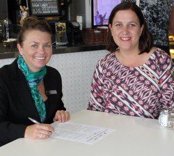 Moorebank Sports Club CEO Tracey Lentell, left, and MP Melanie Gibbons sign the memorandum of understanding yesterday.
