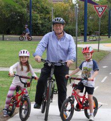 Learn to Ride: Mayor Paul Lake with local youngsters Hannah and Jack.