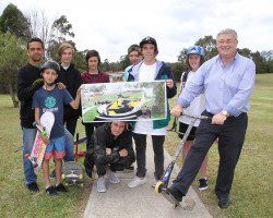 Mayor Paul Lake, right, with some locals keenly interested in how their new skate part at St Helens Park will look like when completed.