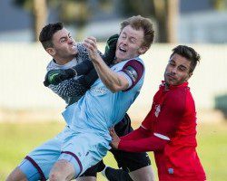 A tussle for the ball during the United versus Tigers match yesterday at Edensor Park. Picture: Football NSW.