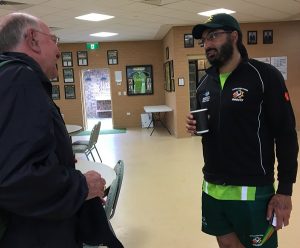 An England fan says hello to Monty Panesar at Raby Sports Complex this morning, where rain held up the start of play between the Ghosts and Uni of NSW.