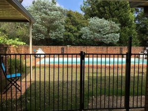 A child proof fence around backyard pools is one of the essential actions in water safety for kids.
