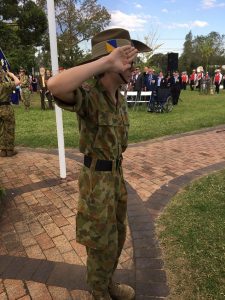 army cadet salutes during the playing of The Last Post at Thirlmere's Anzac Day march and service on Sunday.