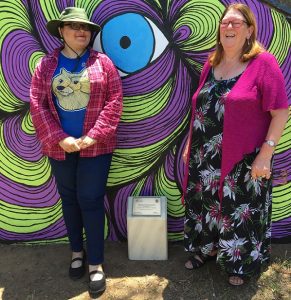 Meg Oates with artist Jessica Fesic and her pedestrian underpass mural.
