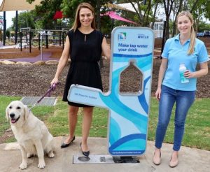 Camden Mayor Lara Symkowiak, Kelly Climo from Sydney Water and Maggie the dog at one of the new water stations.