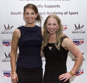 Kaarle McCulloch, the 2018 Commonwealth Games track cyclist and gold medal winner (right) with her  sister Abby, who plays netball with the Swifts