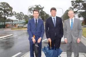 Mayor George Brticevic with Angus Taylor and Paul Fletcher on Badgally Road, which will benefit from the money saved on the Eagle Vale Road upgrade.
