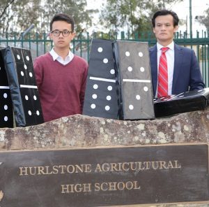 Anoulack Chanthivong with 2016 Hurlstone graduate Adam Herman outside the iconic school.