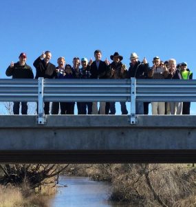 MP Angus Taylor and residents near Goulburn give the thumbs up to a new bridge.