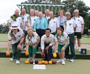 Anoulack Chanthivong with members of the Ingleburn Bowling and Recreation Club.