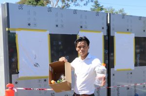 Anoulack Chanthivong with a reverse vending machine in the Ingleburn car park near Woolworths that was not operating.