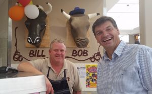 Angus Taylor with Mt Annan Quality Butchers owner Robert Mills, left, who supports lower company taxes.