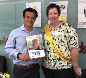 Angela Lonergan, a local Cancer Advocacy Network (CanAct) volunteer presented Macquarie Fields MP Anoulack Chanthivong with the Saving Life 2019 document.
