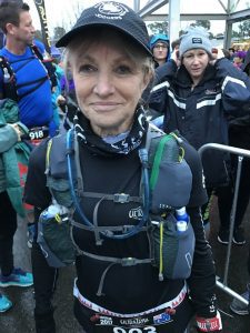 Exhausted and after a change of clothes, Carolyn Knights is the first runner in her age group, the over 60s, to cross the finish line