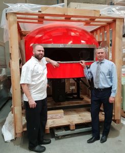 Luke Risby, Head Chef of Country Club Gledswood Hills with Wests Group Macarthur CEO Tony Mathew during delivery of the giant wood fired pizza oven.