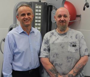 Kelvin Burns, right, who lost more than 100kg with the help of Dr Nic Kormas and the team at the Camden Metabolic Rehabilitation Clinic.