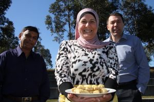Mayor of Campbelltown George Brticevic, right, with Cr Masood Chowdhury and Monda Dehaini with a plate of Lebanese baklava. She’ll be doing a Middle Eastern cooking demonstration at multicultural celebration Feast Campbelltown on September 22.