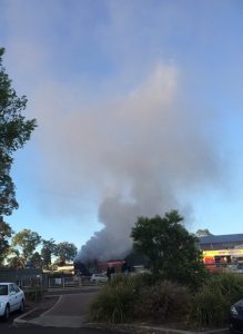 Smoke is billowing out of the Leumeah station shops as fire crews try bring it under control just after 6am.