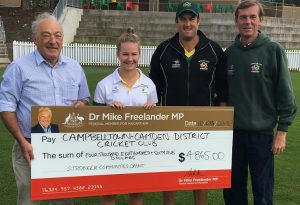 Dr Freelander presents a $4,685 to Ghosts cricket club