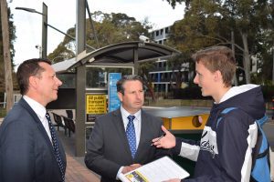 Campbelltown MP Greg Warren and Wollongong MP Paul Scully (left) talk with University of Wollongong student, Jack Taylor regarding the 887 bus service.