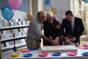 Campbelltown MP Greg Warren cutting the cake at the HJ Daley Library’s 27th anniversary with Federal Member for Macarthur Dr Mike Freelander and Campbelltown City Councillor Margaret Chivers.