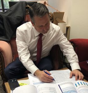 Labor MP Greg Warren perusing the State Budget papers earlier today.