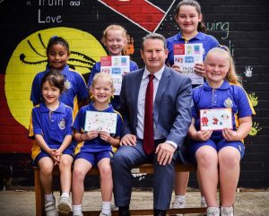 MP Greg Warren with the winners of his annual Chrismas card design competition.
