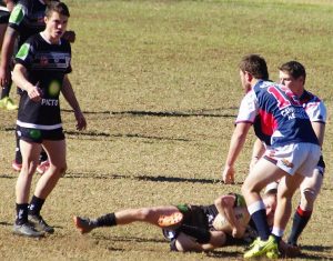a Magpies player player is tackled by Camden in the thriller at Victoria Park won by the home side 20-14.