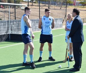 Minister for Sport Stuart Ayres at Narellan’s Macarthur regional hockey centre with local hockey players.