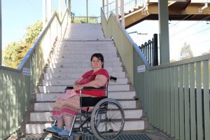 MP Anoulack Chanthivong says local commuters, including Rosemary Hoy, deserve facilities such as a lift at Macquarie Fields Station.