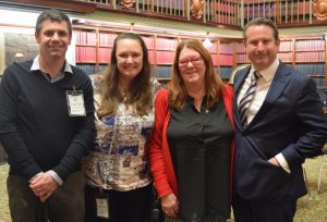 Ross and Kim, the son and daughter of Meg Oates, in parliament with MP Greg Warren.