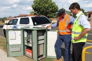 Hume MP Angus Taylor, right, at Narellan Vale with NBN field services senior supervisor for Sydney region Rick Knoester.