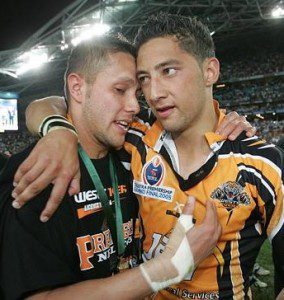 Now an author: Scott Prince, left, with Benji Marshall on the night they won the 2005 premiership with the Wests Tigers.