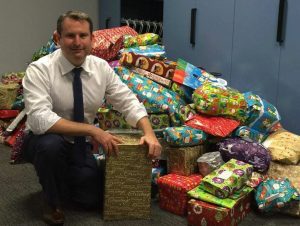 The local MP with some of the toys collected in last year's drive.