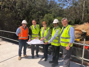 George Brticevic, second from left, next to Senator Marise Payne during an inspection of work on the new bridge at the entrance to Wedderburn 