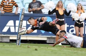 Corey Thompson scores the winning try for the Wests Tigers
